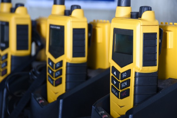Yellow portable two way GMDSS VHF radio using on the ship during emergency safety or security situation, such as abandon ship or fire. Compulsory equipment of the vessel.